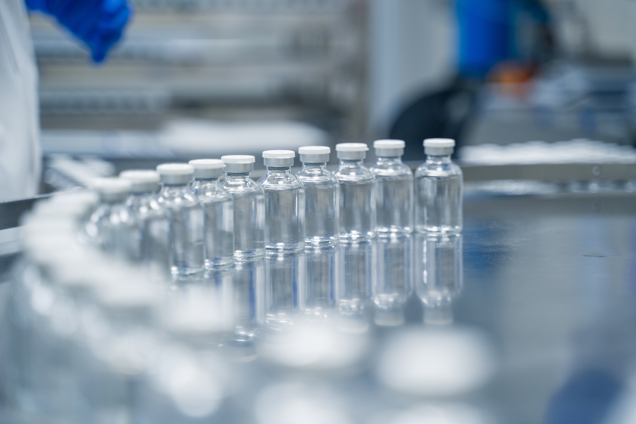 Bottles on a conveyor belt at a pharmaceutical bottle manufacturing plant